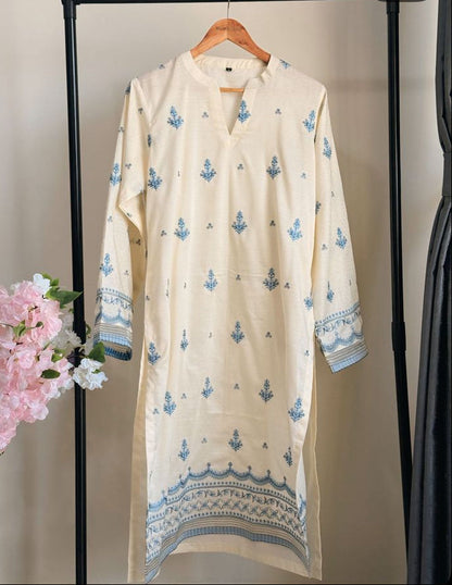 Long beige dress with blue patterns on a hanger against a neutral background